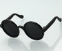 Dog wearing stylish UV-protective pet goggles with padded frame and adjustable straps for outdoor protection.